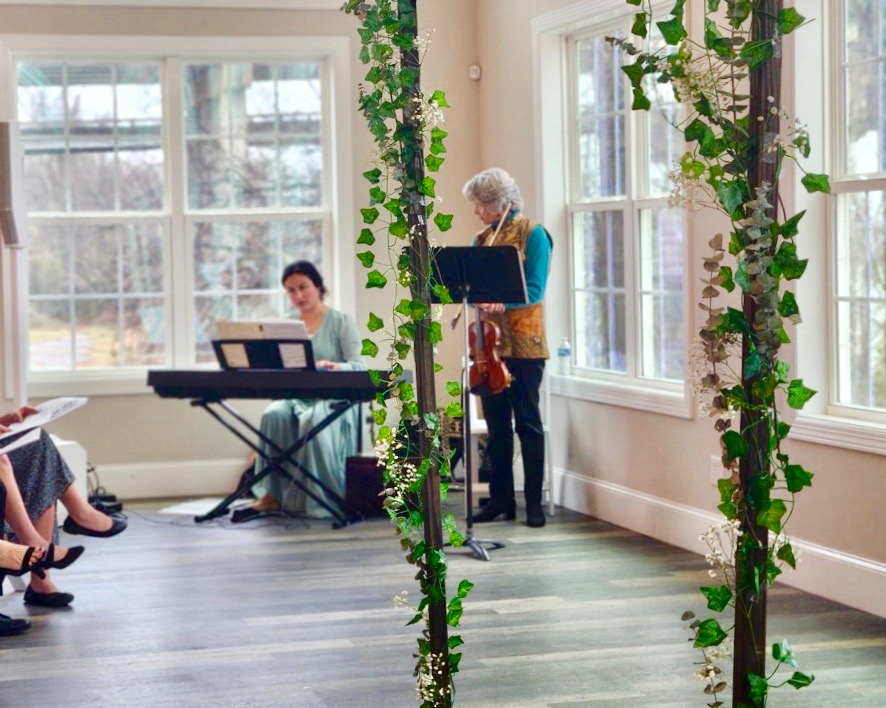 Pianist and Violinist at a wedding, playing ceremony music
